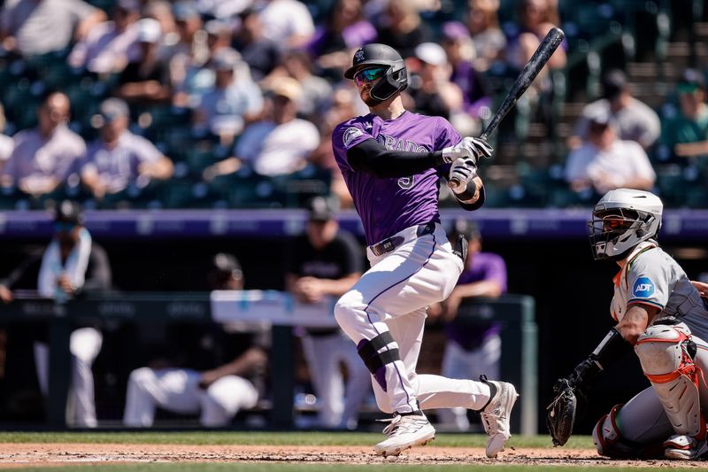 Aug 29, 2024; Denver, Colorado, USA; Colorado Rockies center fielder Brenton Doyle (9) watches his ball on a double in the second inning against the Miami Marlins at Coors Field. Mandatory Credit: Isaiah J. Downing-USA TODAY Sports