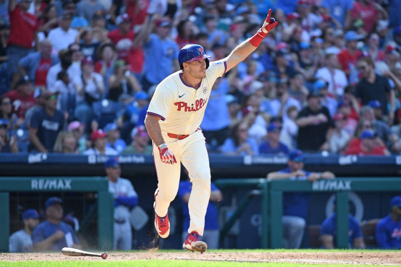 Sep 15, 2024; Philadelphia, Pennsylvania, Philadelphia Phillies catcher J.T. Realmuto (10) hits a walk-off RBI single during the ninth inning against the New York Mets USA; at Citizens Bank Park. Mandatory Credit: Eric Hartline-Imagn Images