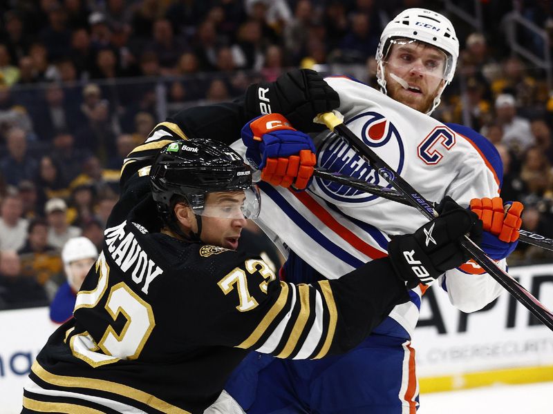 Mar 5, 2024; Boston, Massachusetts, USA; Boston Bruins defenseman Charlie McAvoy (73) stands up Edmonton Oilers center Connor McDavid (97) during the first period at TD Garden. Mandatory Credit: Winslow Townson-USA TODAY Sports