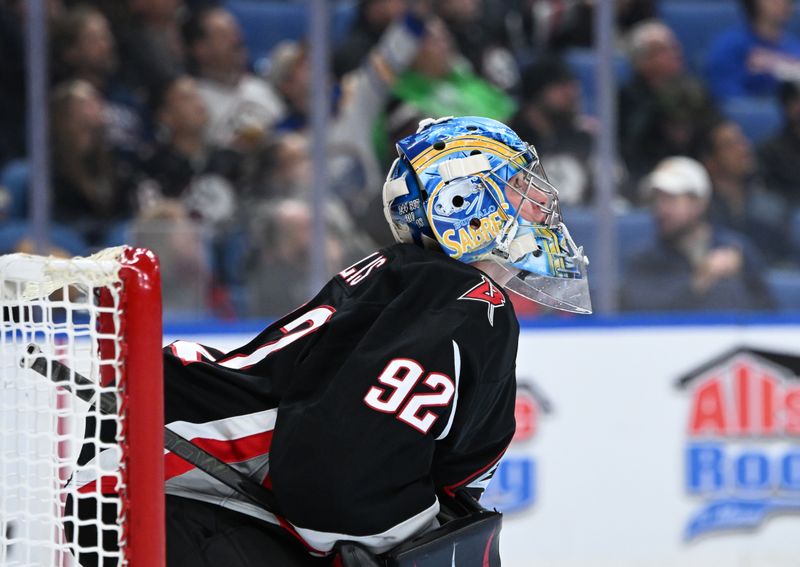 Nov 19, 2025; Buffalo, New York, USA; Buffalo Sabres goaltender Colten Ellis (92) watches a reply on the screen in the first period against the Calgary Flames at KeyBank Center. Mandatory Credit: Mark Konezny-Imagn Images
