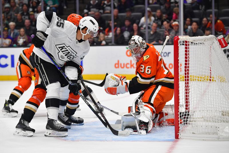 Nov 29, 2024; Anaheim, California, USA; Los Angeles Kings right wing Quinton Byfield (55) moves in for the rebound against Anaheim Ducks goaltender John Gibson (36) during the first period at Honda Center. Mandatory Credit: Gary A. Vasquez-Imagn Images