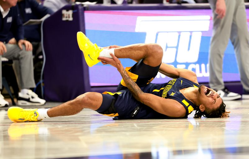 Feb 12, 2024; Fort Worth, Texas, USA; West Virginia Mountaineers guard Noah Farrakhan (1) reacts after an injury during the second half against the TCU Horned Frogs at Ed and Rae Schollmaier Arena. Mandatory Credit: Kevin Jairaj-USA TODAY Sports