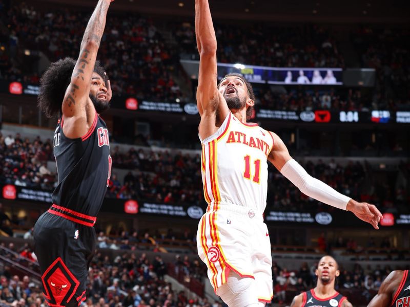 CHICAGO, IL - NOVEMBER 22: Trae Young #11 of the Atlanta Hawks drives to the basket during the game against the Chicago Bulls during the Emirates NBA Cup game on November 22, 2024 at United Center in Chicago, Illinois. NOTE TO USER: User expressly acknowledges and agrees that, by downloading and or using this photograph, User is consenting to the terms and conditions of the Getty Images License Agreement. Mandatory Copyright Notice: Copyright 2024 NBAE (Photo by Jeff Haynes/NBAE via Getty Images)