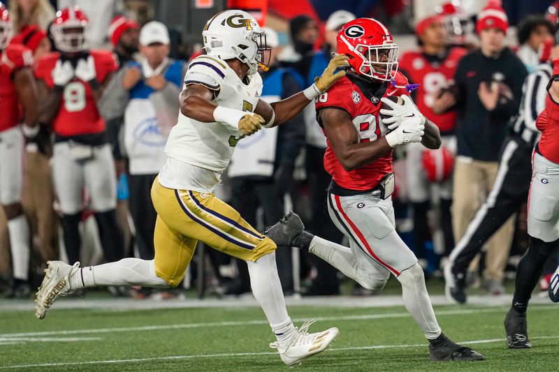Nov 25, 2023; Atlanta, Georgia, USA; Georgia Bulldogs wide receiver Dillon Bell (86) runs against Georgia Tech Yellow Jackets linebacker Andre White (3) during the second half at Hyundai Field. Mandatory Credit: Dale Zanine-USA TODAY Sports