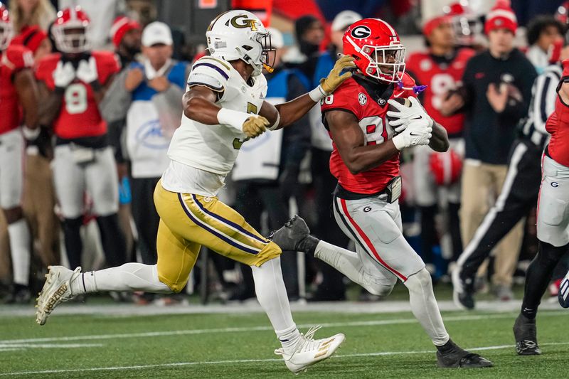 Nov 25, 2023; Atlanta, Georgia, USA; Georgia Bulldogs wide receiver Dillon Bell (86) runs against Georgia Tech Yellow Jackets linebacker Andre White (3) during the second half at Hyundai Field. Mandatory Credit: Dale Zanine-USA TODAY Sports