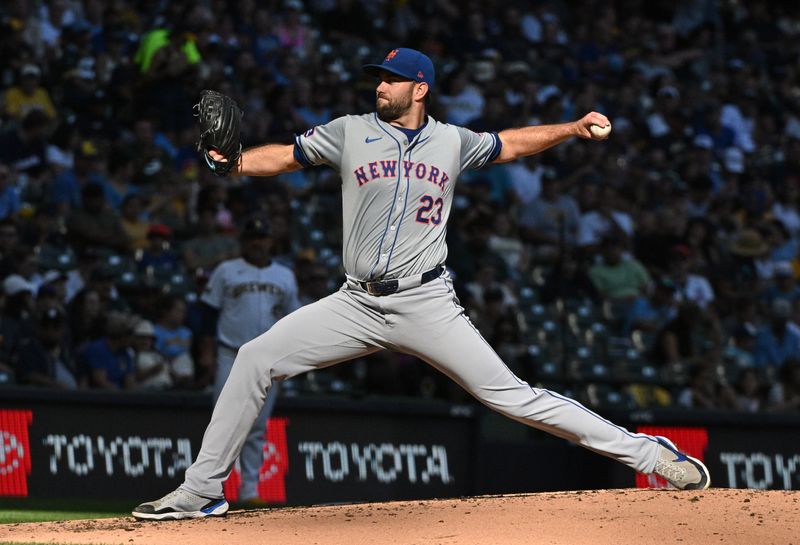 Sep 29, 2024; Milwaukee, Wisconsin, USA; New York Mets pitcher David Peterson (23) delivers a pitch against the Milwaukee Brewers in the fourth inning at American Family Field. Mandatory Credit: Michael McLoone-Imagn Images