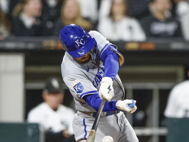 Sep 13, 2023; Chicago, Illinois, USA; Kansas City Royals shortstop Nick Loftin (12) hits an RBI-single against the Chicago White Sox during the seventh inning at Guaranteed Rate Field. Mandatory Credit: Kamil Krzaczynski-USA TODAY Sports