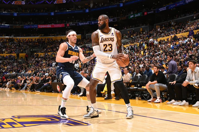 LOS ANGELES, CA - APRIL 27: LeBron James #23 of the Los Angeles Lakers handles the ball during the game against the Denver Nuggets during Round 1 Game 4 of the 2024 NBA Playoffs on April 27, 2024 at Crypto.Com Arena in Los Angeles, California. NOTE TO USER: User expressly acknowledges and agrees that, by downloading and/or using this Photograph, user is consenting to the terms and conditions of the Getty Images License Agreement. Mandatory Copyright Notice: Copyright 2024 NBAE (Photo by Andrew D. Bernstein/NBAE via Getty Images)