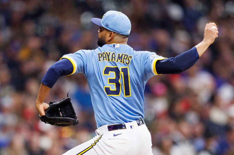 Apr 7, 2023; Milwaukee, Wisconsin, USA;  Milwaukee Brewers pitcher Joel Payamps (31) throws a pitch during the sixth inning against the St. Louis Cardinals at American Family Field. Mandatory Credit: Jeff Hanisch-USA TODAY Sports