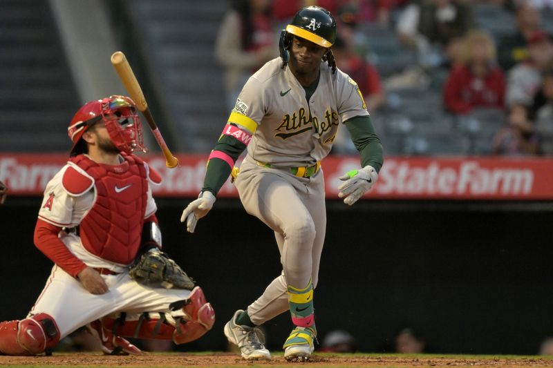 Jun 9, 2025; Anaheim, California, USA;   Athletics right fielder Lawrence Bulter (4) slams his bat after a fly out in the fifth inning against the Los Angeles Angels at Angel Stadium. Mandatory Credit: Jayne Kamin-Oncea-Imagn Images