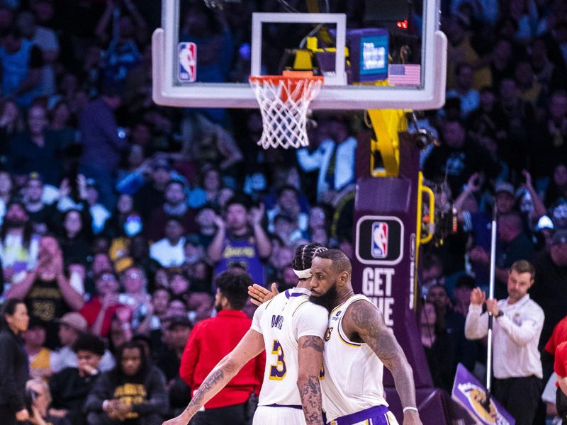 LOS ANGELES, CA - MARCH 10:  LeBron James #23 of the Los Angeles Lakers and Anthony Davis #3 high five during the game against the Minnesota Timberwolves on March 10, 2024 at Crypto.Com Arena in Los Angeles, California. NOTE TO USER: User expressly acknowledges and agrees that, by downloading and/or using this Photograph, user is consenting to the terms and conditions of the Getty Images License Agreement. Mandatory Copyright Notice: Copyright 2024 NBAE (Photo by Tyler Ross/NBAE via Getty Images)