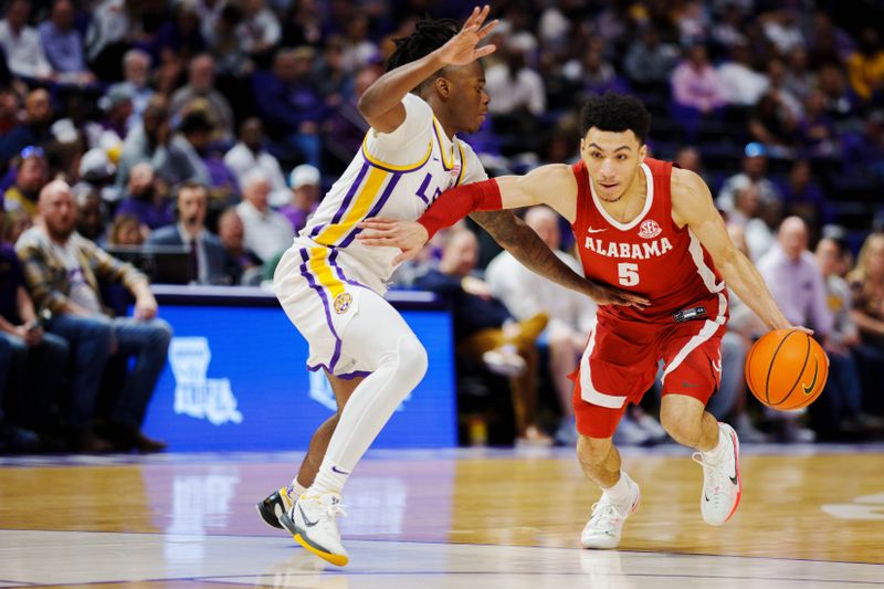 Feb 4, 2023; Baton Rouge, Louisiana, USA; Alabama Crimson Tide guard Jahvon Quinerly (5) drives to the basket against LSU Tigers guard Cam Hayes (1) during the second half at Pete Maravich Assembly Center. Mandatory Credit: Andrew Wevers-USA TODAY Sports