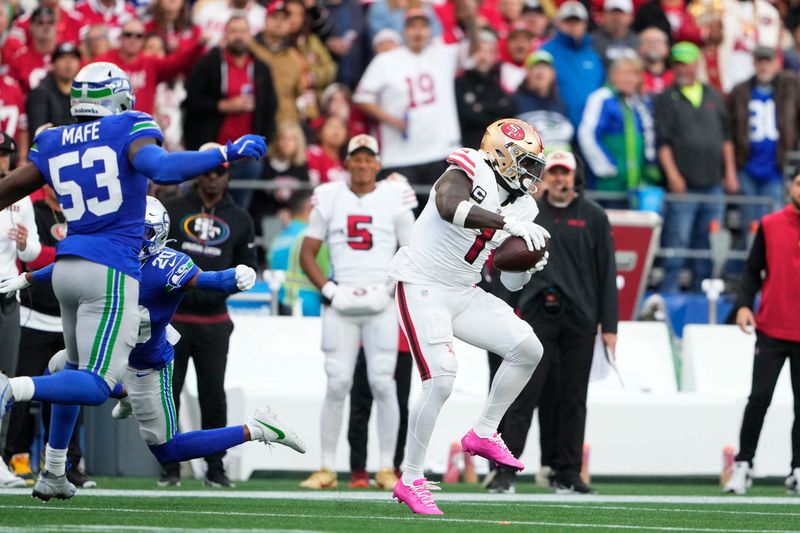 San Francisco 49ers wide receiver Deebo Samuel Sr. (1) makes a touchdown cartch during the first half of an NFL football game against the Seattle Seahawks, Thursday, Oct. 10, 2024, in Seattle. (AP Photo/Lindsey Wasson)
