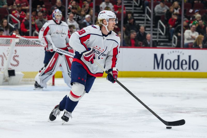 Dec 10, 2023; Chicago, Illinois, USA; Washington Capitals defenseman Rasmus Sandin (38) skates with the puck against the Chicago Blackhawks during the first period at the United Center. Mandatory Credit: Daniel Bartel-USA TODAY Sports