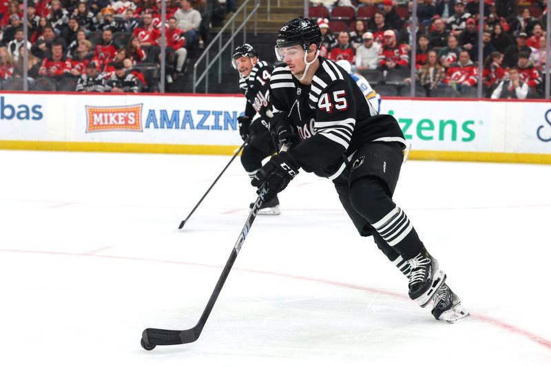 Nov 26, 2025; Newark, New Jersey, USA; New Jersey Devils defenseman Colton White (45) skates with the puck against the St. Louis Blues during the first period at Prudential Center. Mandatory Credit: Ed Mulholland-Imagn Images