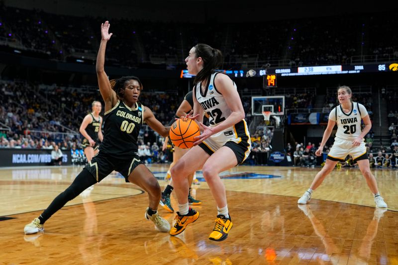 Mar 30, 2024; Albany, NY, USA; Iowa Hawkeyes guard Caitlin Clark (22) dribbles the ball against Colorado Buffaloes guard Jaylyn Sherrod (0) in the semifinals of the Albany Regional of the 2024 NCAA Tournament at the MVP Arena. Mandatory Credit: Gregory Fisher-USA TODAY Sports