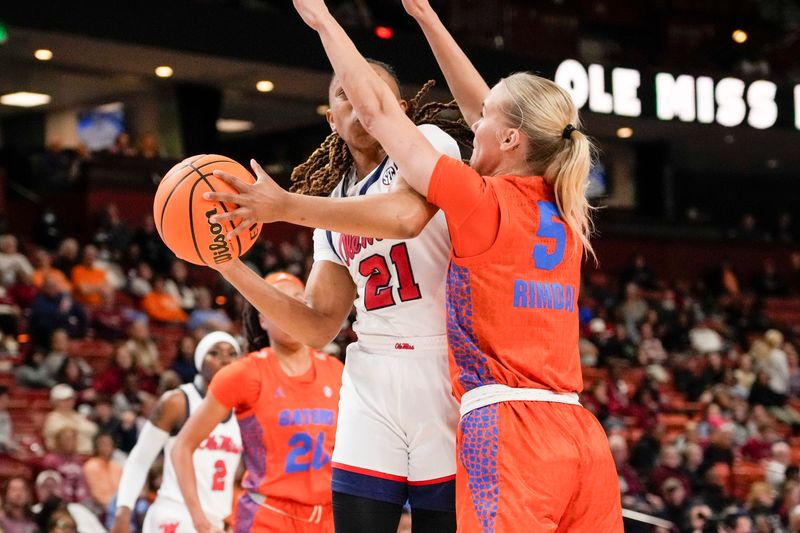 Mar 8, 2024; Greensville, SC, USA; Ole Miss Rebels guard Zakiya Stephenson (21) is blocked by Florida Gators guard Alberte Rimdal (5) during the first half at Bon Secours Wellness Arena. Mandatory Credit: Jim Dedmon-USA TODAY Sports