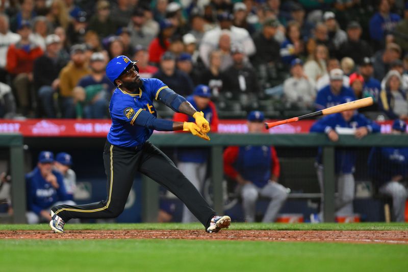 Sep 14, 2024; Seattle, Washington, USA; Seattle Mariners designated hitter Randy Arozarena (56) loses his bat a strike three pitch against the Texas Rangers during the fifth inning at T-Mobile Park. Mandatory Credit: Steven Bisig-Imagn Images