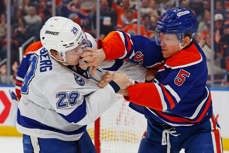 Mar 21, 2026; Edmonton, Alberta, CAN; Edmonton Oilers defensemen Connor Murphy (5) and Tampa Bay Lightning forward Pontus Holmberg (29) fight during the second period at Rogers Place. Mandatory Credit: Perry Nelson-Imagn Images Mar 21, 2026; Edmonton, Alberta, CAN; Edmonton Oilers defensemen Connor Murphy (5) and Tampa Bay Lightning forward Pontus Holmberg (29) fight during the second period at Rogers Place. Mandatory Credit: Perry Nelson-Imagn Images