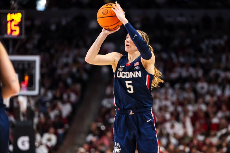 Feb 11, 2024; Columbia, South Carolina, USA; UConn Huskies guard Paige Bueckers (5) shoots against the South Carolina Gamecocks in the second half at Colonial Life Arena. Mandatory Credit: Jeff Blake-USA TODAY Sports