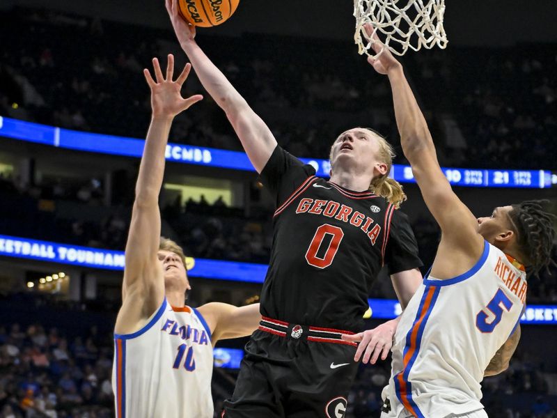 Mar 14, 2024; Nashville, TN, USA;  Georgia Bulldogs guard Blue Cain (0) splits Florida Gators forward Thomas Haugh (10) and guard Will Richard (5) during the first half at Bridgestone Arena. Mandatory Credit: Steve Roberts-USA TODAY Sports