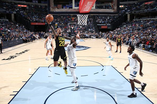 MEMPHIS, TN - NOVEMBER 29:  John Collins #20 of the Utah Jazz goes to the basket during the game on November 29, 2023 at FedExForum in Memphis, Tennessee. NOTE TO USER: User expressly acknowledges and agrees that, by downloading and or using this photograph, User is consenting to the terms and conditions of the Getty Images License Agreement. Mandatory Copyright Notice: Copyright 2023 NBAE (Photo by Joe Murphy/NBAE via Getty Images)