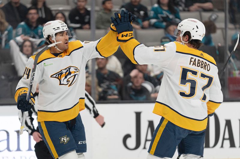 Feb 24, 2024; San Jose, California, USA; Nashville Predators left wing Kiefer Sherwood (44) celebrates with defenseman Dante Fabbro (57) after scoring a goal during the first period against the San Jose Sharks at SAP Center at San Jose. Mandatory Credit: Stan Szeto-USA TODAY Sports