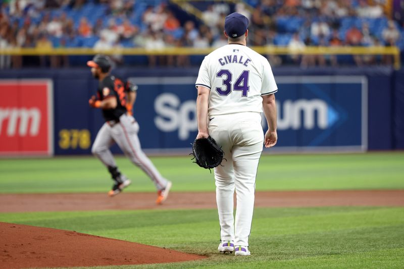 Jun 7, 2024; St. Petersburg, Florida, USA;Tampa Bay Rays pitcher Aaron Civale (34) looks on as Baltimore Orioles outfielder Anthony Santander (25) runs around the bases after he hits a home run at Tropicana Field. Mandatory Credit: Kim Klement Neitzel-USA TODAY Sports