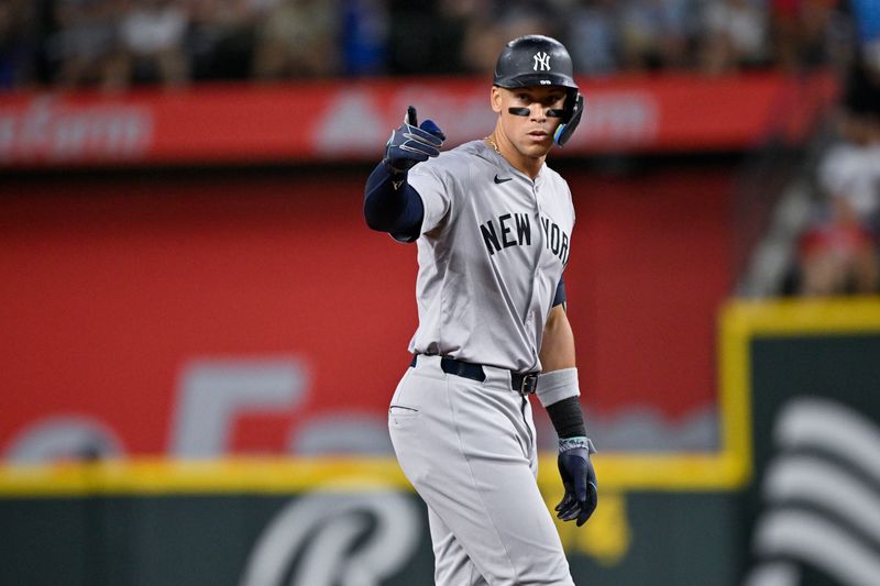 Sep 2, 2024; Arlington, Texas, USA; New York Yankees center fielder Aaron Judge (99) celebrates at second base after he hits a double and drives in a run against the Texas Rangers during the sixth inning at Globe Life Field. Mandatory Credit: Jerome Miron-USA TODAY Sports