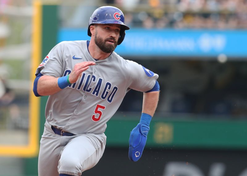 May 1, 2025; Pittsburgh, Pennsylvania, USA;  Chicago Cubs third baseman Jon Berti (5) runs to third base against the Pittsburgh Pirates during the ninth inning at PNC Park. Mandatory Credit: Charles LeClaire-Imagn Images