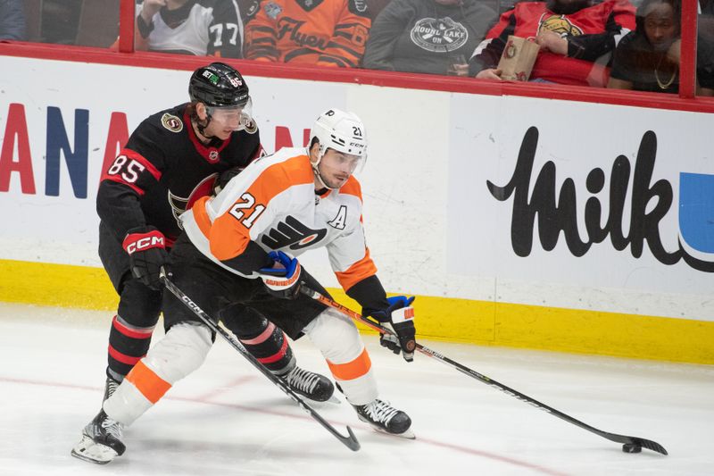 Mar 30, 2023; Ottawa, Ontario, CAN; Ottawa Senators defenseman Jake Sanderson (85) battles with Philadelphia Flyers center Scott Laughton (21) in the third period at the Canadian Tire Centre. Mandatory Credit: Marc DesRosiers-USA TODAY Sports