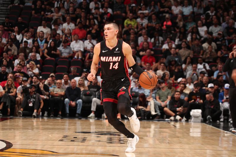 MIAMI, FL - NOVEMBER 4: Tyler Herro #14 of the Miami Heat dribbles the ball during the game against the Sacramento Kings   during a regular season game on November 4, 2024 at Kaseya Center in Miami, Florida. NOTE TO USER: User expressly acknowledges and agrees that, by downloading and or using this Photograph, user is consenting to the terms and conditions of the Getty Images License Agreement. Mandatory Copyright Notice: Copyright 2024 NBAE (Photo by Issac Baldizon/NBAE via Getty Images)