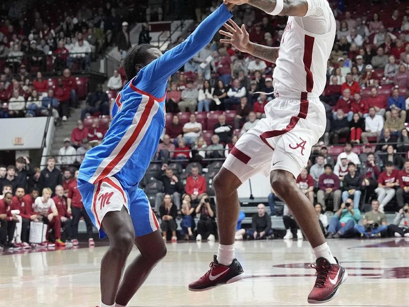 Jan 14, 2025; Tuscaloosa, AL, USA;  Alabama guard Labaron Philon (0) makes a pass around Ole Miss guard Jaylen Murray (5) at Coleman Coliseum. Mandatory Credit: Gary Cosby Jr.-USA TODAY Network via Imagn Images