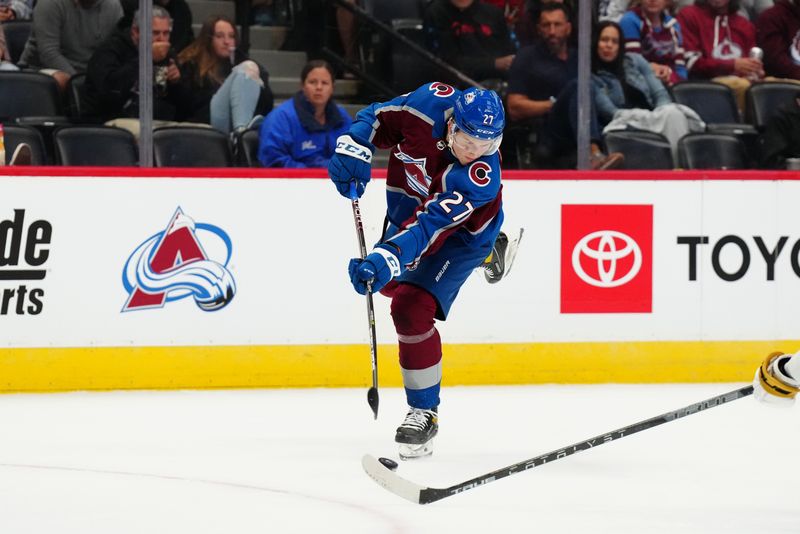 Sep 25, 2022; Denver, Colorado, USA; Colorado Avalanche left wing Oskar Olausson (27) shoots the puck in the second period against the Vegas Golden Knights at Ball Arena. Mandatory Credit: Ron Chenoy-USA TODAY Sports