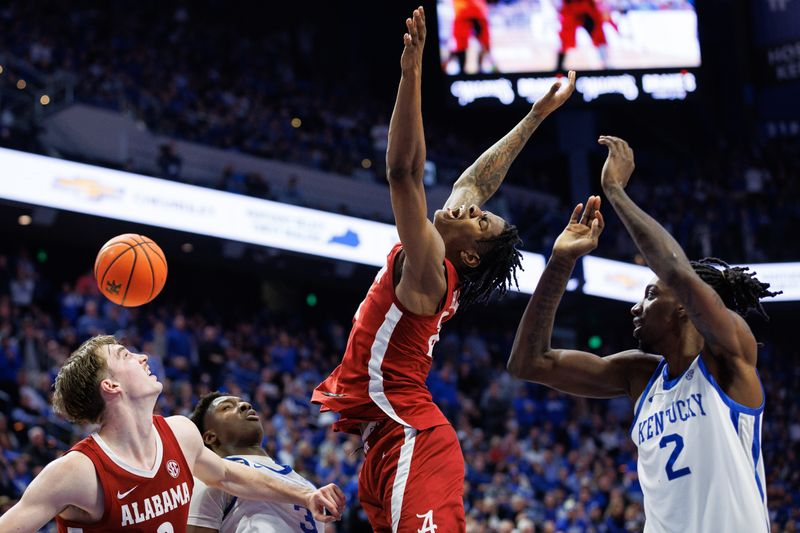 Feb 24, 2024; Lexington, Kentucky, USA; Alabama Crimson Tide forward Nick Pringle (23) loses control of the ball as he goes to the basket during the first half against the Kentucky Wildcats at Rupp Arena at Central Bank Center. Mandatory Credit: Jordan Prather-USA TODAY Sports