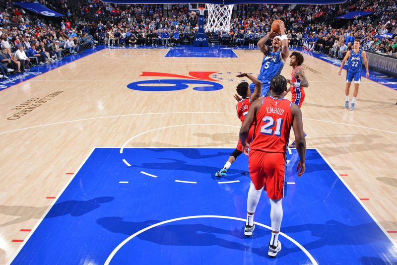 PHILADELPHIA, PA - APRIL 12: Paolo Banchero #5 of the Orlando Magic shoots the ball during the game against the Philadelphia 76ers on April 12, 2024 at the Wells Fargo Center in Philadelphia, Pennsylvania NOTE TO USER: User expressly acknowledges and agrees that, by downloading and/or using this Photograph, user is consenting to the terms and conditions of the Getty Images License Agreement. Mandatory Copyright Notice: Copyright 2024 NBAE (Photo by Jesse D. Garrabrant/NBAE via Getty Images)