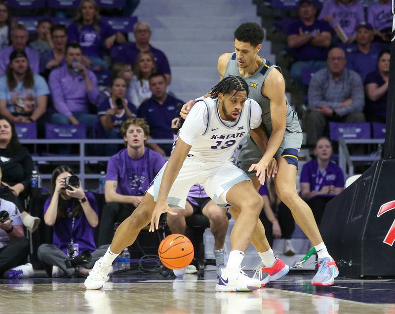 Feb 26, 2024; Manhattan, Kansas, USA; Kansas State Wildcats center Will McNair Jr. (13) is guarded by West Virginia Mountaineers center Jesse Edwards (7) during the second half at Bramlage Coliseum. Mandatory Credit: Scott Sewell-USA TODAY Sports