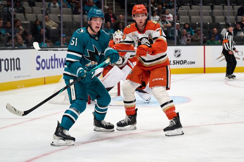 Oct 1, 2025; San Jose, California, USA; San Jose Sharks right wing Collin Graf (51) vies for position against Anaheim Ducks defenseman Ian Moore (74) during the second period at SAP Center at San Jose. Mandatory Credit: Robert Edwards-Imagn Images