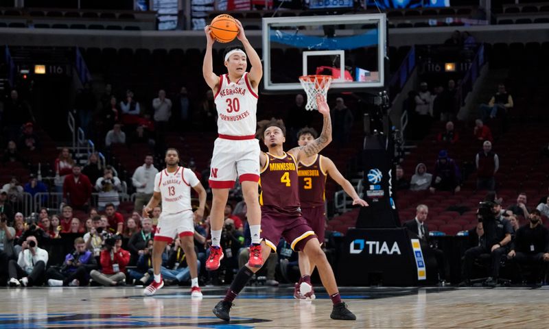 Mar 8, 2023; Chicago, IL, USA; Nebraska Cornhuskers guard Keisei Tominaga (30) is defended by Minnesota Golden Gophers guard Braeden Carrington (4) during the second half at United Center. Mandatory Credit: David Banks-USA TODAY Sports