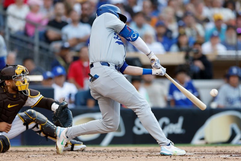 Jul 31, 2024; San Diego, California, USA; Los Angeles Dodgers second baseman Gavin Lux (9) hits a RBI double during the third inning against the San Diego Padres at Petco Park. Mandatory Credit: David Frerker-USA TODAY Sports