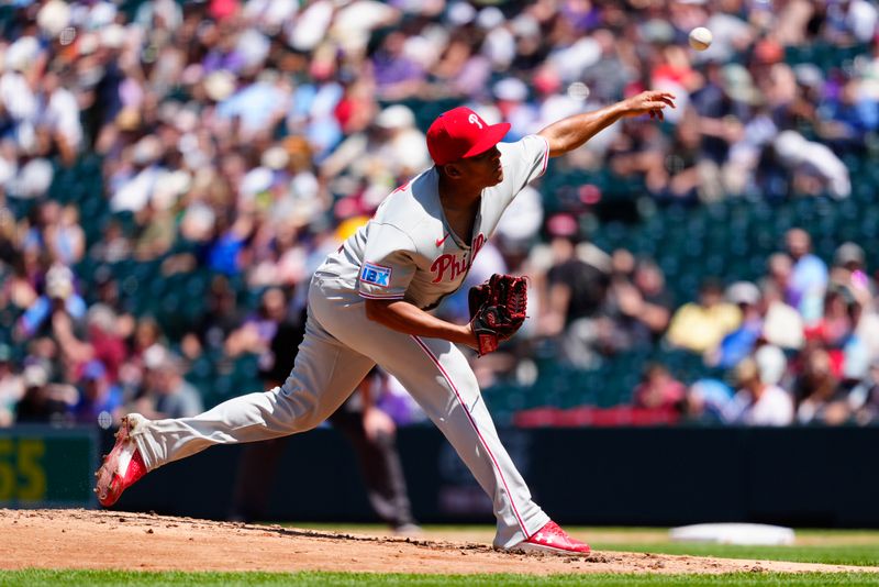 May 22, 2025; Denver, Colorado, USA; Philadelphia Phillies starting pitcher Ranger Suarez (55) delivers a pitch in the fifth inning against the Colorado Rockies at Coors Field. Mandatory Credit: Ron Chenoy-Imagn Images