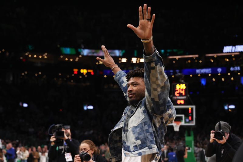 BOSTON, MASSACHUSETTS - FEBRUARY 04: Marcus Smart #36 of the Memphis Grizzlies waves to the crowd as he is honored during a game against the Boston Celtics at TD Garden on February 04, 2024 in Boston, Massachusetts. NOTE TO USER: User expressly acknowledges and agrees that, by downloading and or using this photograph, User is consenting to the terms and conditions of the Getty Images License Agreement. (Photo by Paul Rutherford/Getty Images)