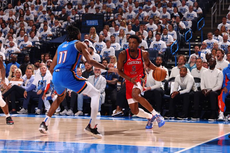 OKLAHOMA CITY, OK - APRIL 24: Herb Jones #5 of the New Orleans Pelicans dribbles the ball during the game against the Oklahoma City Thunder during Round 1 Game 2 of the 2024 NBA Playoffs on April 24, 2024 at Paycom Arena in Oklahoma City, Oklahoma. NOTE TO USER: User expressly acknowledges and agrees that, by downloading and or using this photograph, User is consenting to the terms and conditions of the Getty Images License Agreement. Mandatory Copyright Notice: Copyright 2024 NBAE (Photo by Zach Beeker/NBAE via Getty Images)