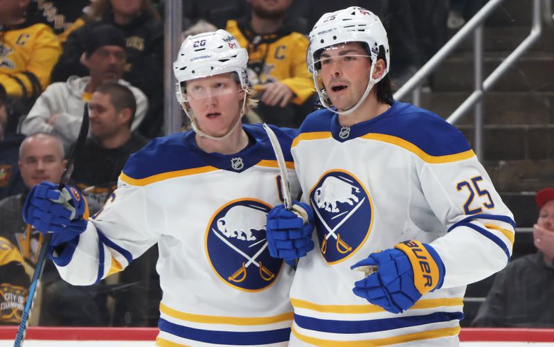 Mar 5, 2026; Pittsburgh, Pennsylvania, USA;  Buffalo Sabres defenseman Rasmus Dahlin (26) and defenseman Owen Power (25) celebrate a goal by Power against the Pittsburgh Penguins during the second period at PPG Paints Arena. Mandatory Credit: Charles LeClaire-Imagn Images