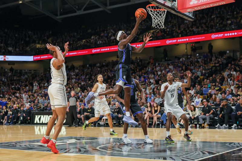 Feb 1, 2025; Orlando, Florida, USA; Brigham Young Cougars forward Mawot Mag (0) goes to the basket during the second half against the UCF Knights at Addition Financial Arena. Mandatory Credit: Mike Watters-Imagn Images