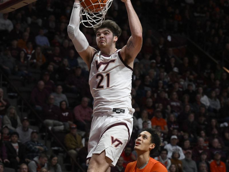 Jan 28, 2023; Blacksburg, Virginia, USA;  Virginia Tech Hokies forward Grant Basile (21) dunks in front of Syracuse Orange center Jesse Edwards (14) in the second half at Cassell Coliseum. Mandatory Credit: Lee Luther Jr.-USA TODAY Sports