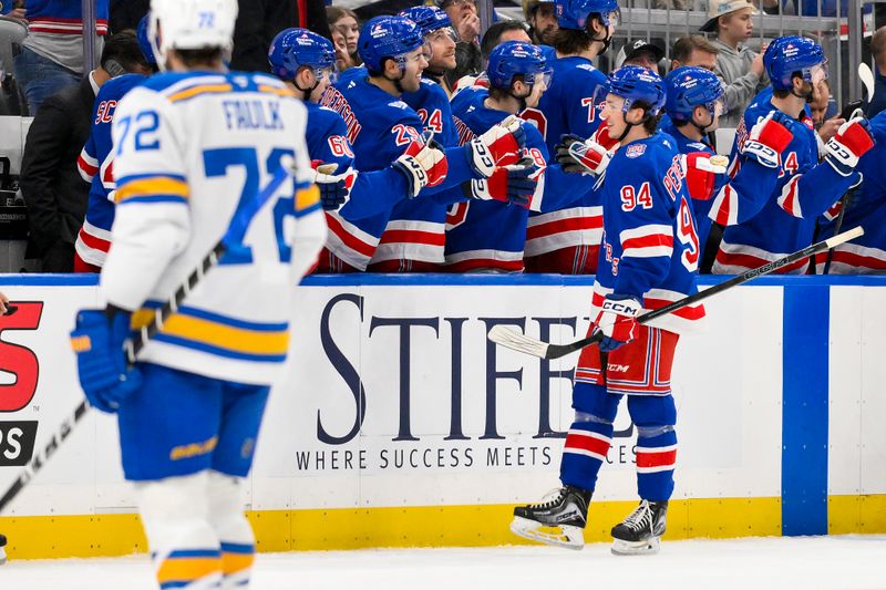 Dec 18, 2025; St. Louis, Missouri, USA; New York Rangers right wing Gabe Perreault (94) is congratulated by teammates after scoring his first NHL goal during the second period against the St. Louis Blues at Enterprise Center. Mandatory Credit: Jeff Curry-Imagn Images