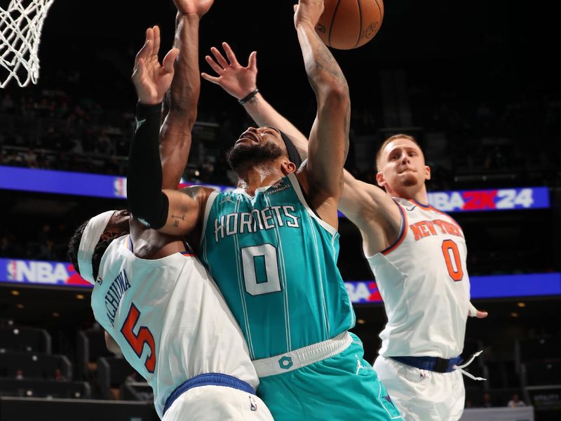 CHARLOTTE, NC - JANUARY 29: Donte Divincenzo #0 of the New York Knicks blocks the shot by Miles Bridges #0 of the Charlotte Hornets during the game on January 29, 2024 at Spectrum Center in Charlotte, North Carolina. NOTE TO USER: User expressly acknowledges and agrees that, by downloading and or using this photograph, User is consenting to the terms and conditions of the Getty Images License Agreement. Mandatory Copyright Notice: Copyright 2024 NBAE (Photo by Kent Smith/NBAE via Getty Images)