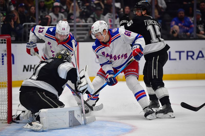 Jan 20, 2026; Los Angeles, California, USA; Los Angeles Kings Los Angeles Kings center Alex Turcotte (15) helps goaltender Anton Forsberg (31) defend the goal against New York Rangers left wing Alexis Lafreniere (13) and defenseman Scott Morrow (60) during the third period at Crypto.com Arena. Mandatory Credit: Gary A. Vasquez-Imagn Images