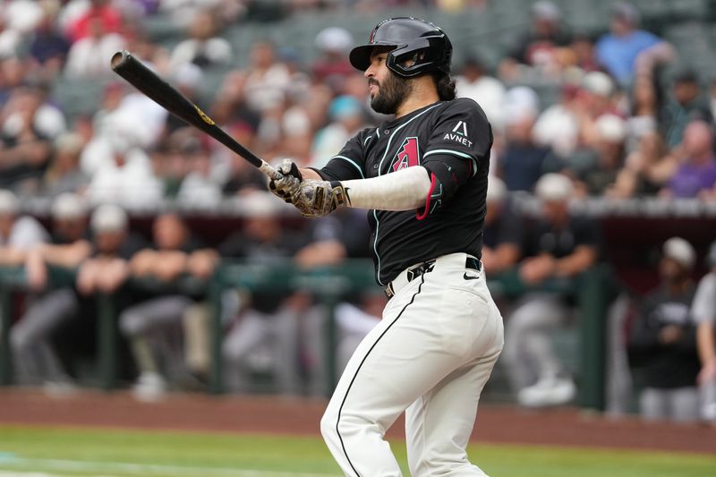 May 17, 2025; Phoenix, Arizona, USA; Arizona Diamondbacks third baseman Eugenio Suarez (28) hits a single against the Colorado Rockies in the first inning at Chase Field. Mandatory Credit: Jacob Reiner-Imagn Images